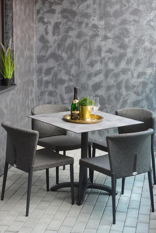 Nápoje v ubytovaní Club Luxury Apartman