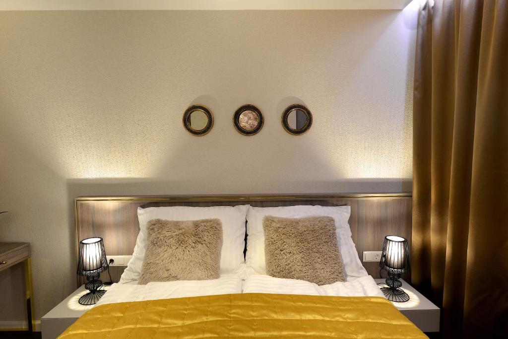 Posteľ alebo postele v izbe v ubytovaní Club Luxury Apartman