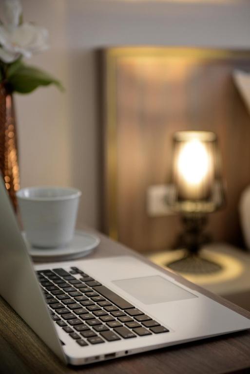 Televízia a/alebo spoločenská miestnosť v ubytovaní Club Luxury Apartman