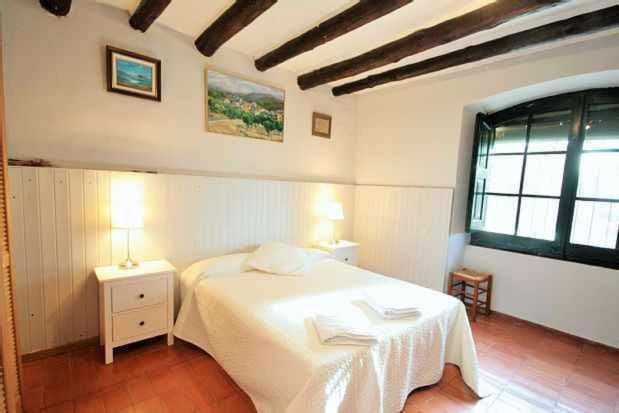 Postel nebo postele na pokoji v ubytování Casa rural alquiler íntegro Cal Sisco