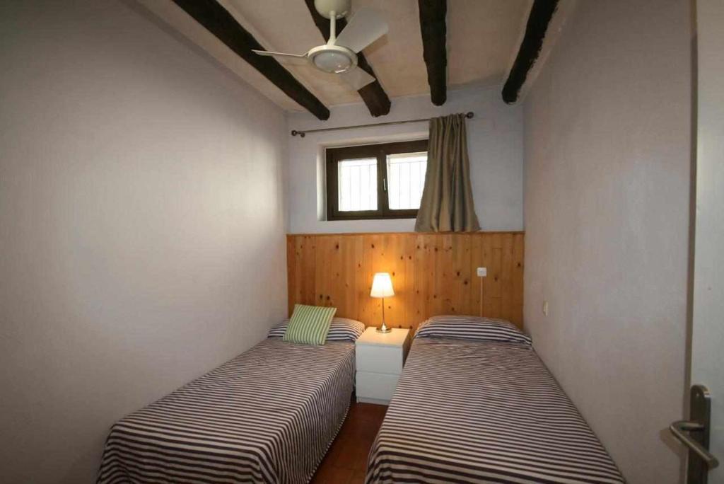 Postel nebo postele na pokoji v ubytování Casa rural alquiler íntegro Cal Sisco