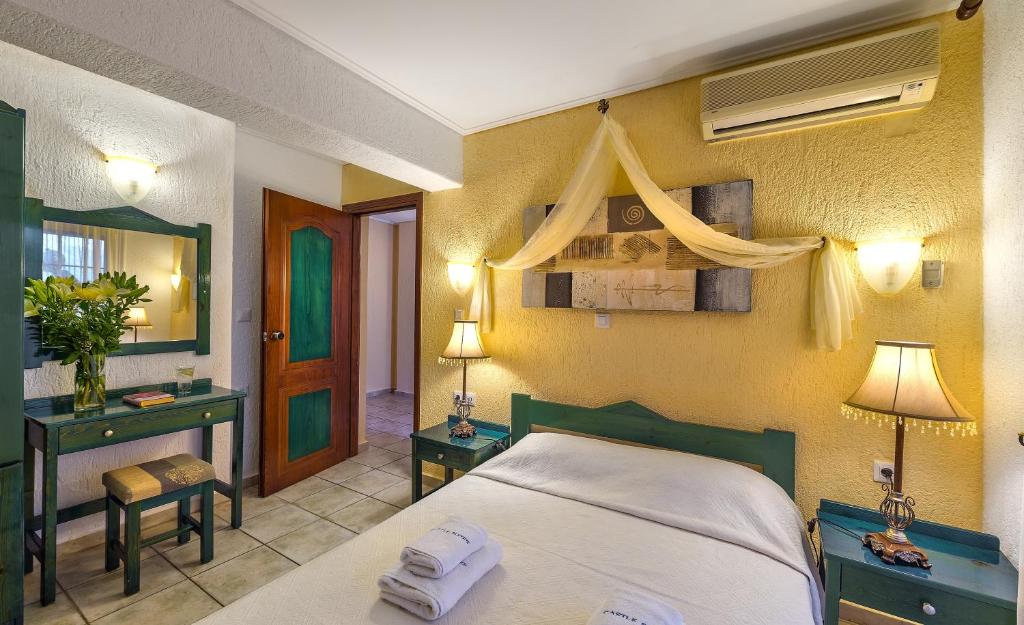 Postel nebo postele na pokoji v ubytování Hotel Castle Suites