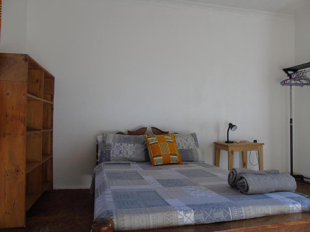Postel nebo postele na pokoji v ubytování IDC Guest House