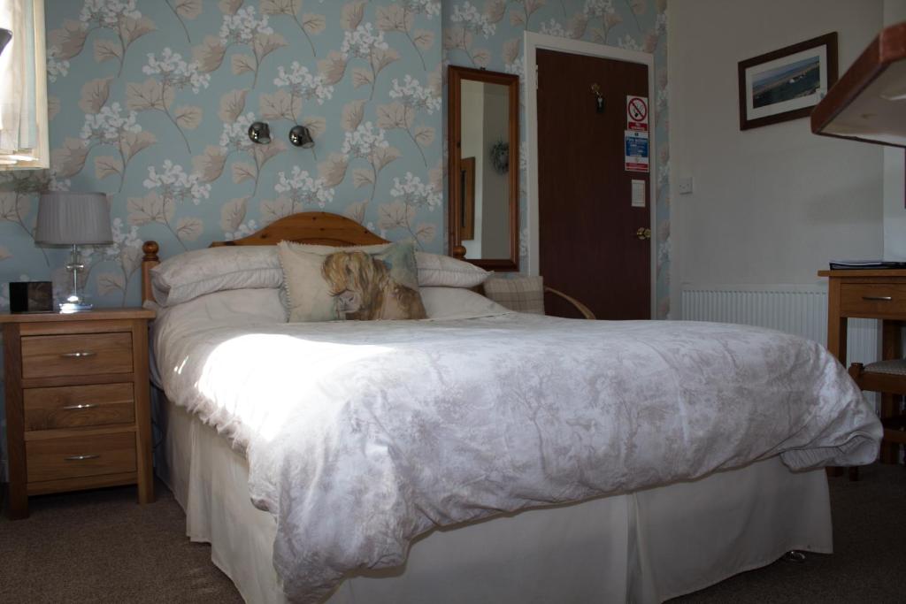Postel nebo postele na pokoji v ubytování Whitecroft B&B