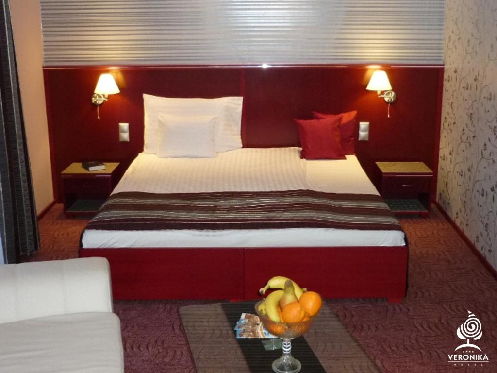 Postel nebo postele na pokoji v ubytování Veronika Hotel