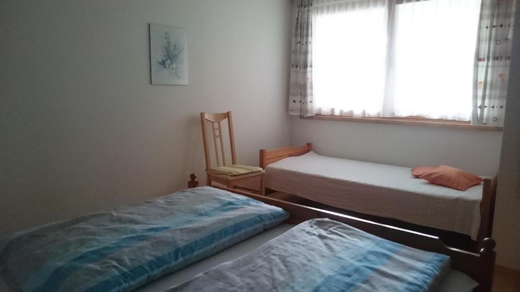 Postel nebo postele na pokoji v ubytování Gästehaus Lutz