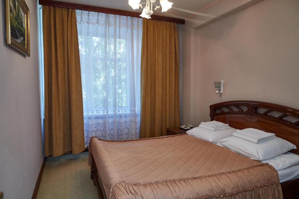 Cama o camas de una habitación en Korolev Hotel