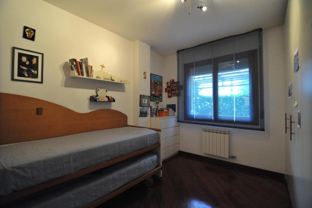 A bed or beds in a room at Appartamento Cavalli