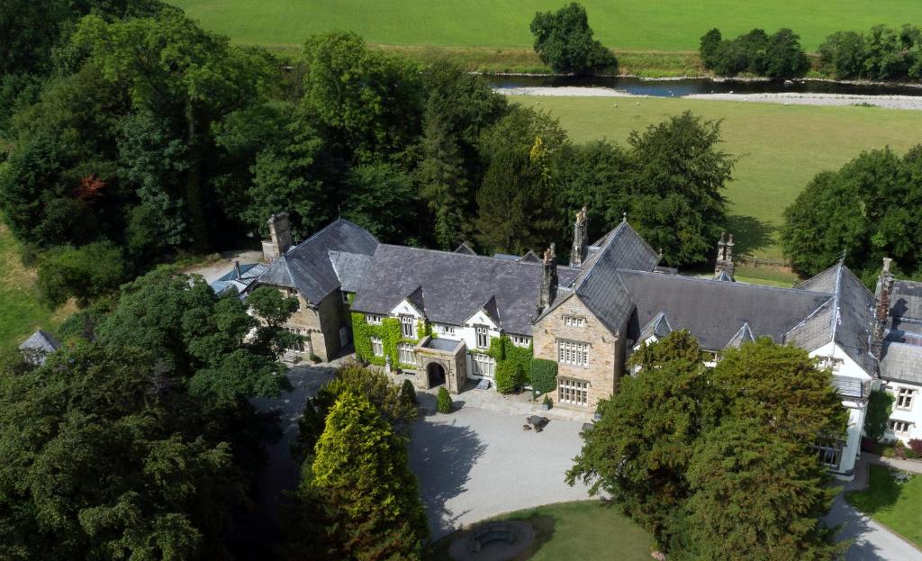 an aerial view of a large house with a yard at Mitton Hall Hotel in Clitheroe