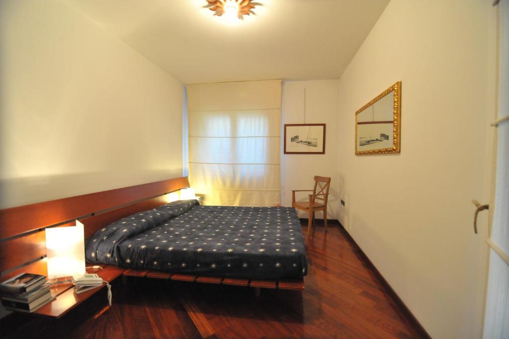 A bed or beds in a room at Appartamento Cavalli