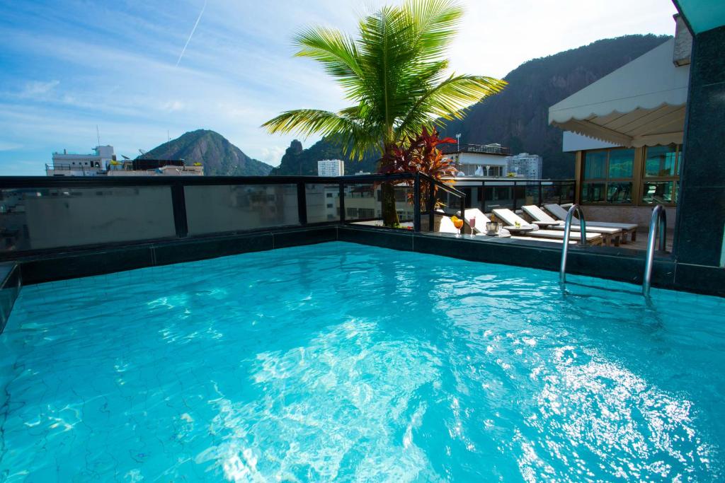 a large swimming pool on the roof of a building at Real Palace Hotel in Rio de Janeiro