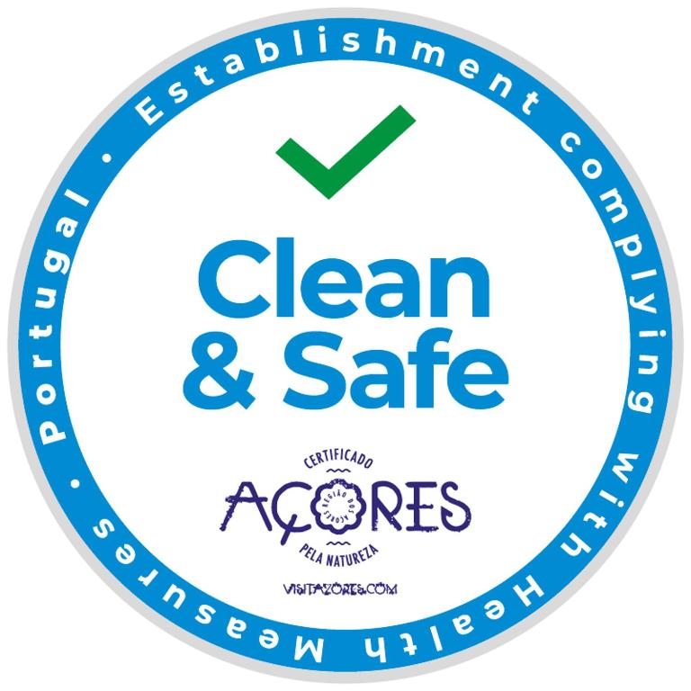a label with the clean and safe acorenes logo at Mojo House in Ribeira Grande