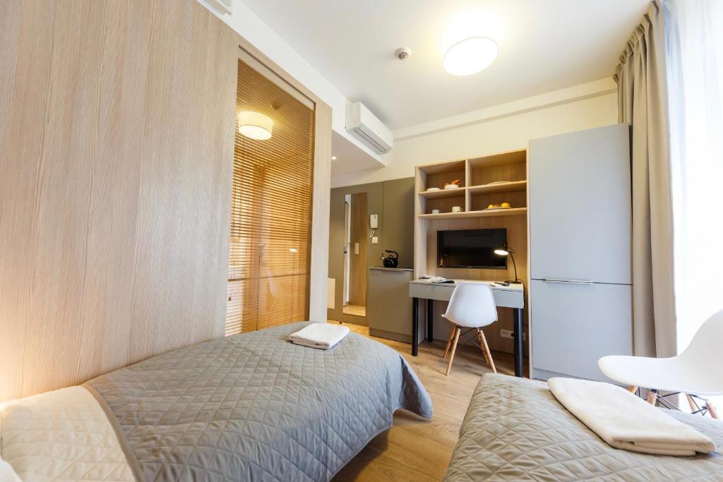 Posteľ alebo postele v izbe v ubytovaní Wolska Residence I