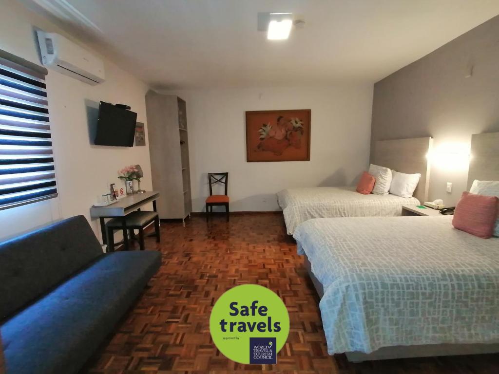 Postel nebo postele na pokoji v ubytování Casa Massima Hotel