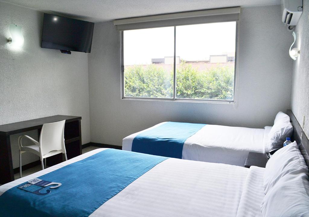 Postel nebo postele na pokoji v ubytování Hotel Ros Gaud