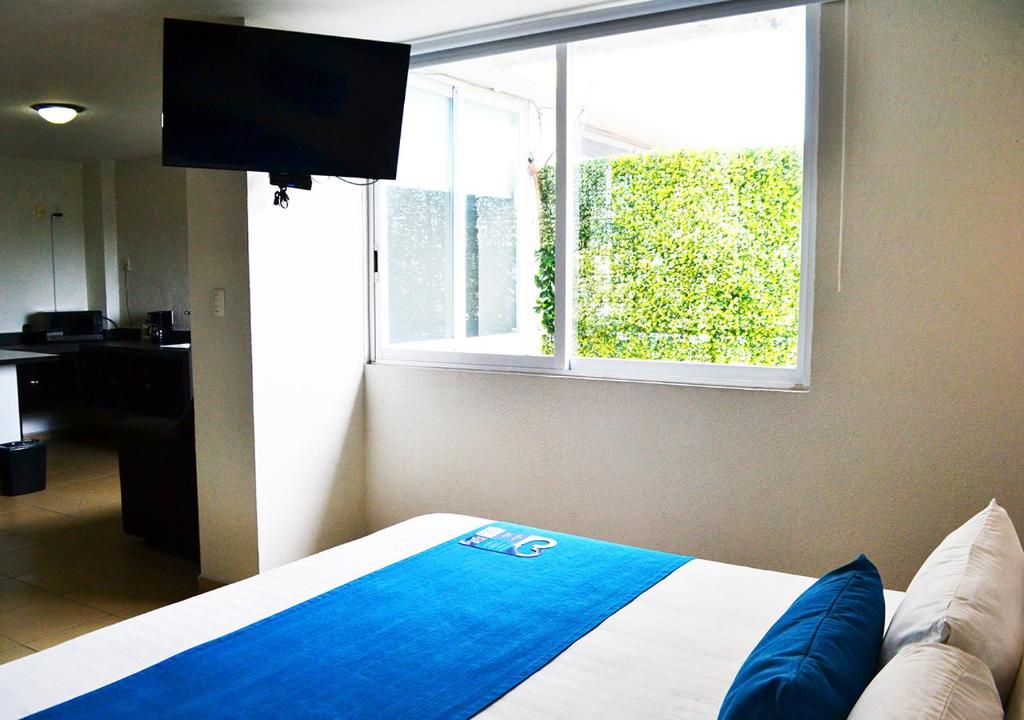 Postel nebo postele na pokoji v ubytování Hotel Ros Gaud
