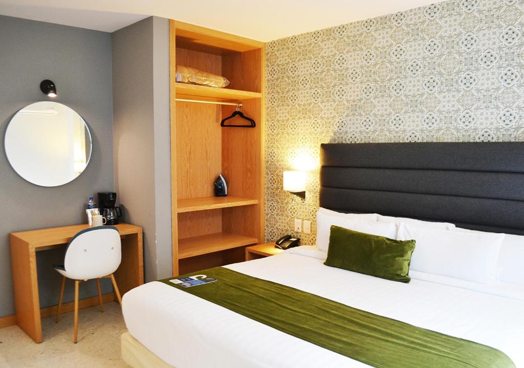 Postel nebo postele na pokoji v ubytování Hotel Ros Gaud