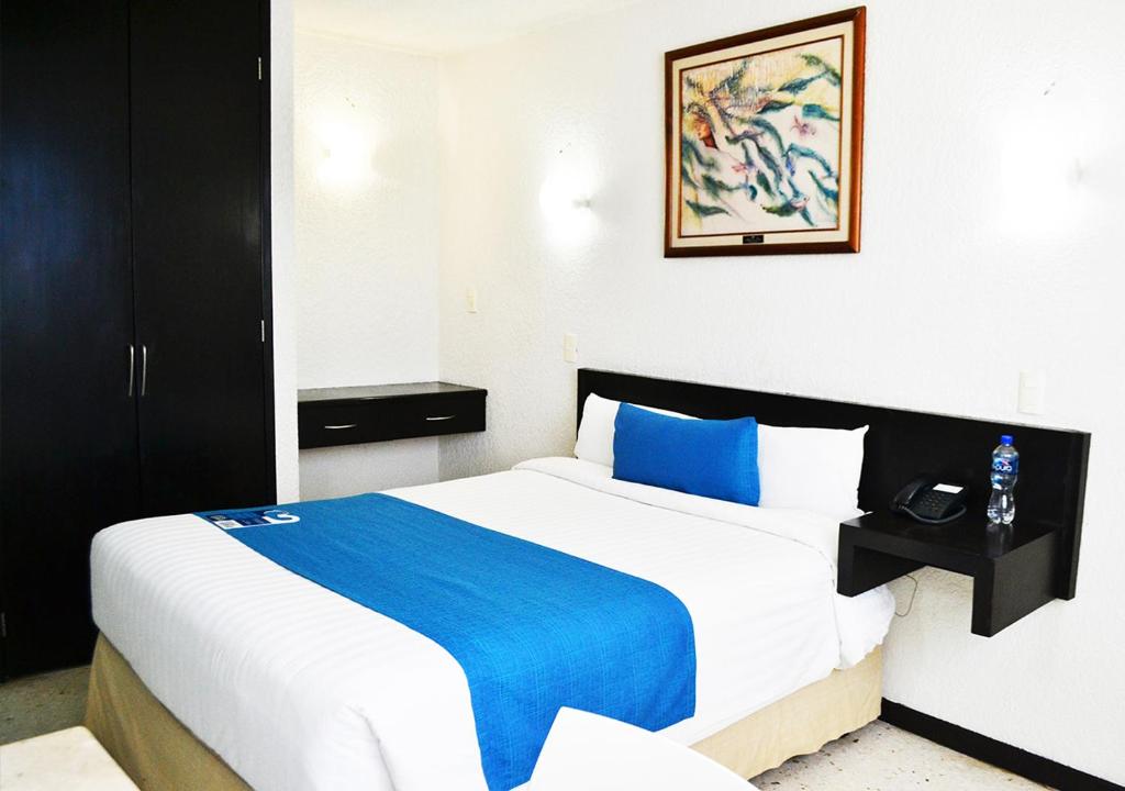 Postel nebo postele na pokoji v ubytování Hotel Ros Gaud