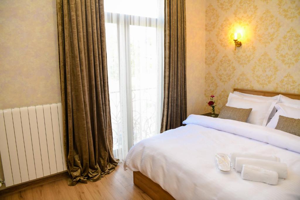 Postel nebo postele na pokoji v ubytování Hotel Late