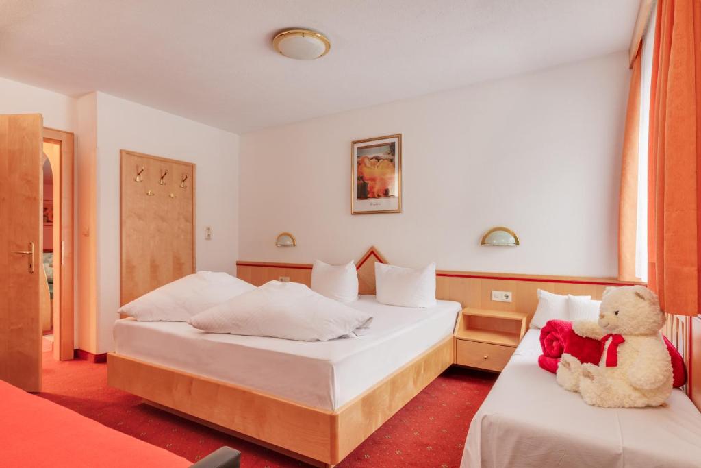 Postel nebo postele na pokoji v ubytování Hotel Albarella