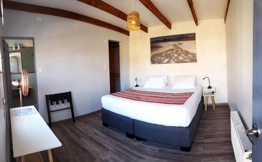 Postel nebo postele na pokoji v ubytování Hotel Jardin Atacama