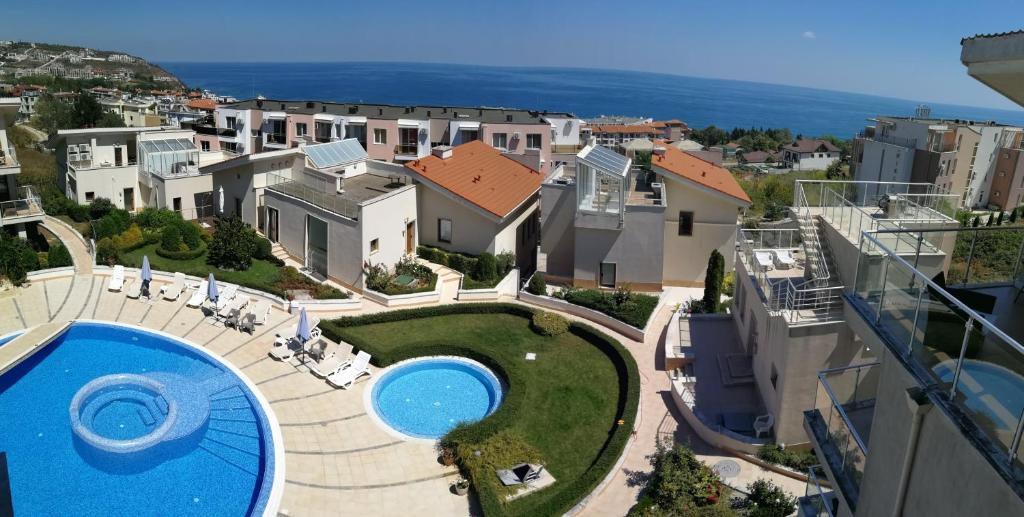 arial view of a house with a swimming pool at Wonderful family villa with sea view in Byala