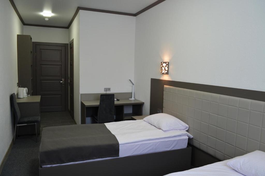 Postel nebo postele na pokoji v ubytování Delta Hotel