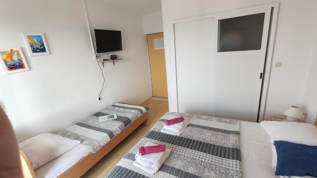 Posteľ alebo postele v izbe v ubytovaní Guesthouse Podaca
