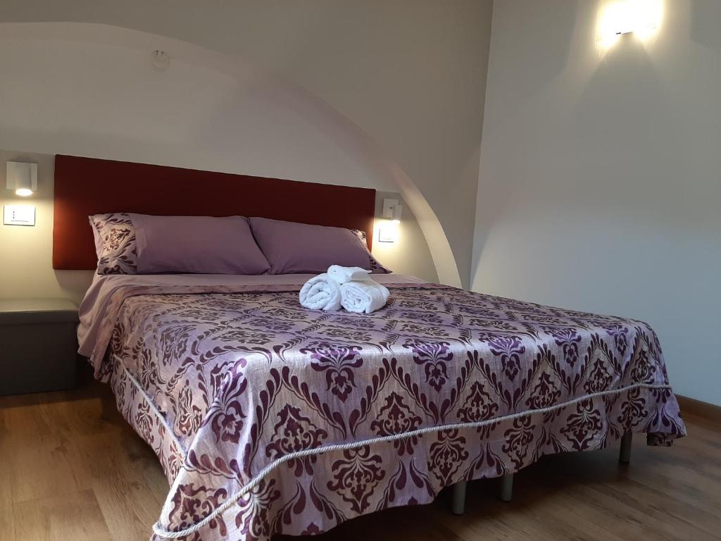 Postel nebo postele na pokoji v ubytování Sabbia del Sud Affittacamere