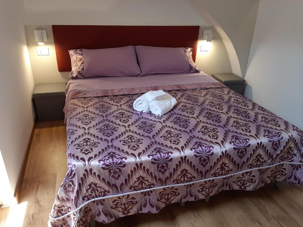 Postel nebo postele na pokoji v ubytování Sabbia del Sud Affittacamere