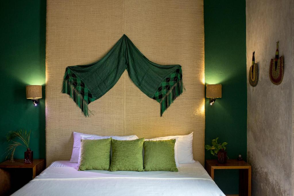 Postel nebo postele na pokoji v ubytování Ya'ax Hotel Boutique