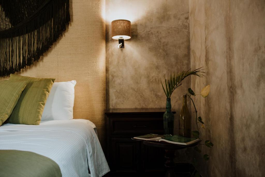 Postel nebo postele na pokoji v ubytování Ya'ax Hotel Boutique