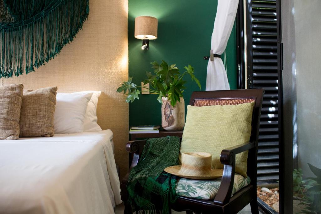 Postel nebo postele na pokoji v ubytování Ya'ax Hotel Boutique