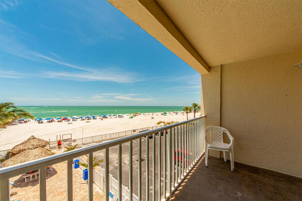 a balcony with a view of the beach at 207 Beach Place Condos in St. Pete Beach