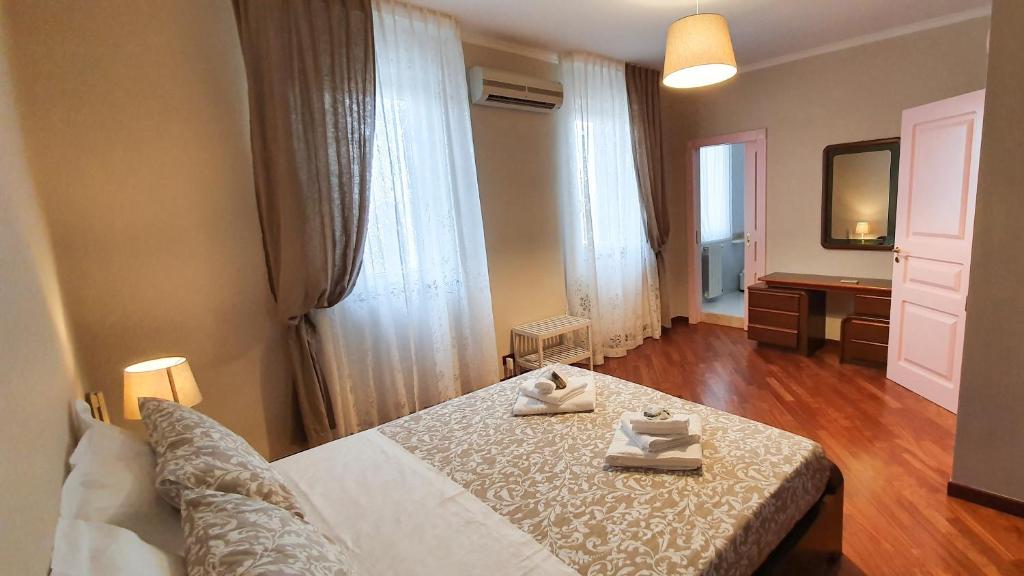 Postel nebo postele na pokoji v ubytování Casa De Amicis 18