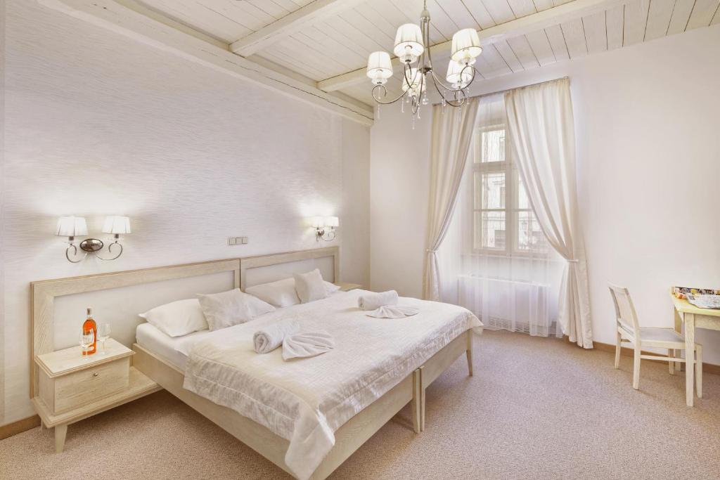 Postel nebo postele na pokoji v ubytování Hotel Lippert