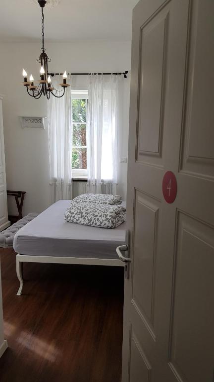 Posteľ alebo postele v izbe v ubytovaní Garni Villa Tyrol - Adults Only