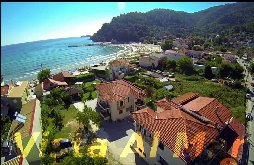 arial view of a beach with houses and the ocean at Vista Al Mar in Skala Potamias