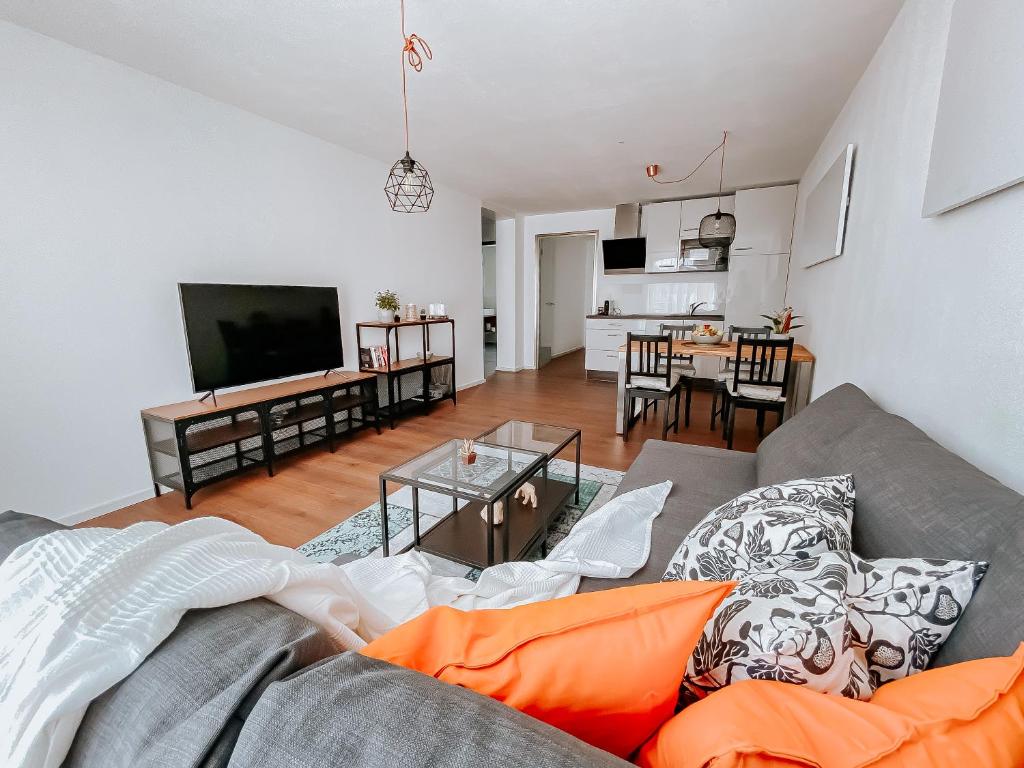 a living room with a couch and a table at W4-Rooms EIN ZUHAUSE IM WALDVIERTEL in Allentsteig