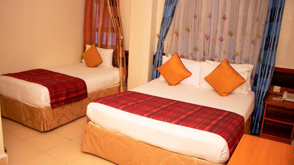 Postel nebo postele na pokoji v ubytování Sheratton Regency Hotel Nairobi