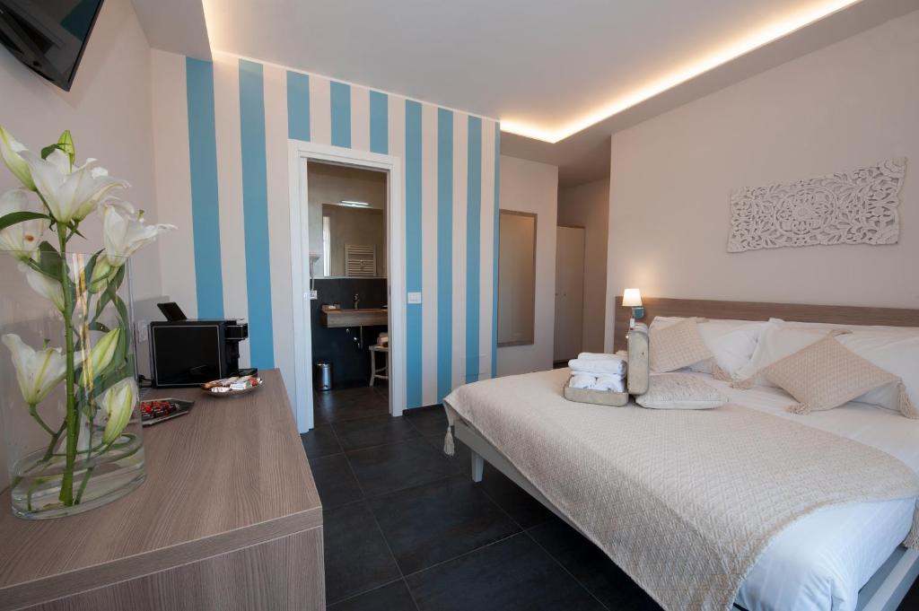 Posteľ alebo postele v izbe v ubytovaní Brichett Deluxe Rooms