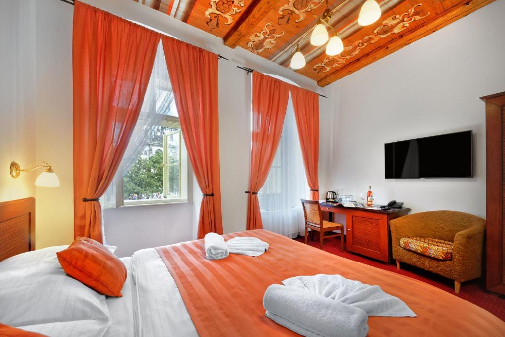 Postel nebo postele na pokoji v ubytování Hotel Lippert