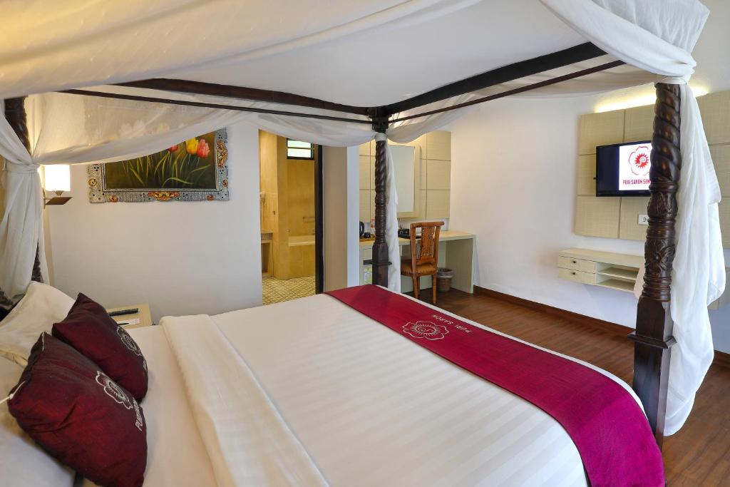 Postel nebo postele na pokoji v ubytování Puri Saron Hotel Seminyak