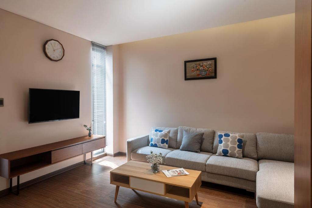 TV a/nebo společenská místnost v ubytování DHTS Business Hotel & Apartment