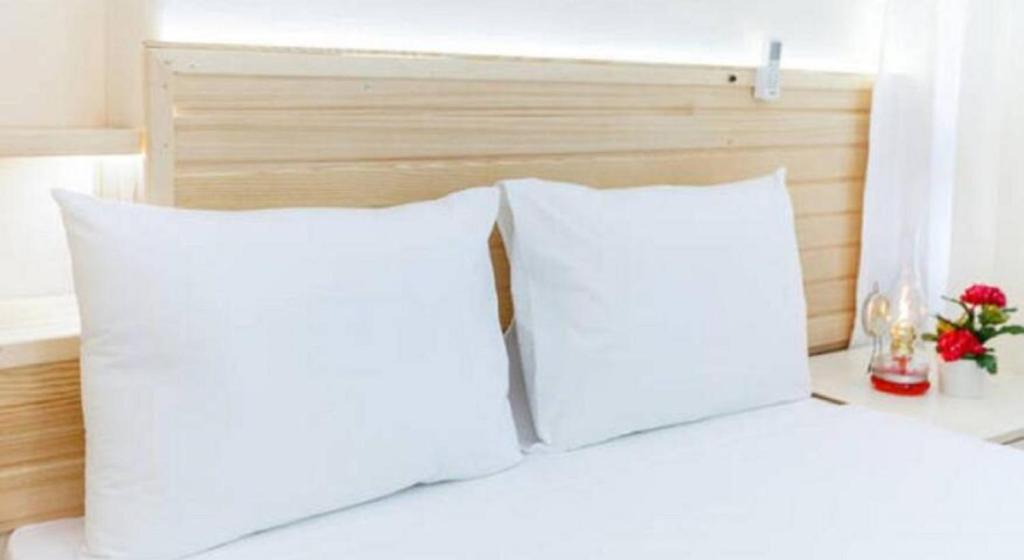 Postel nebo postele na pokoji v ubytování Otantik Hotel