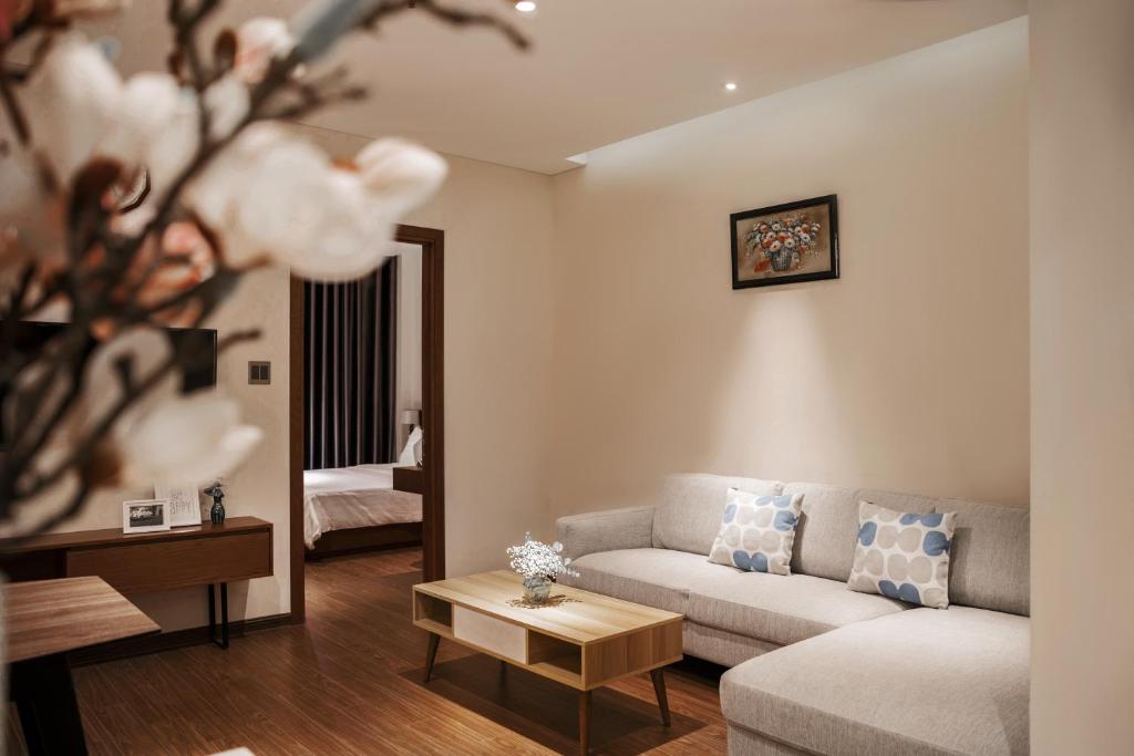 Postel nebo postele na pokoji v ubytování DHTS Business Hotel & Apartment