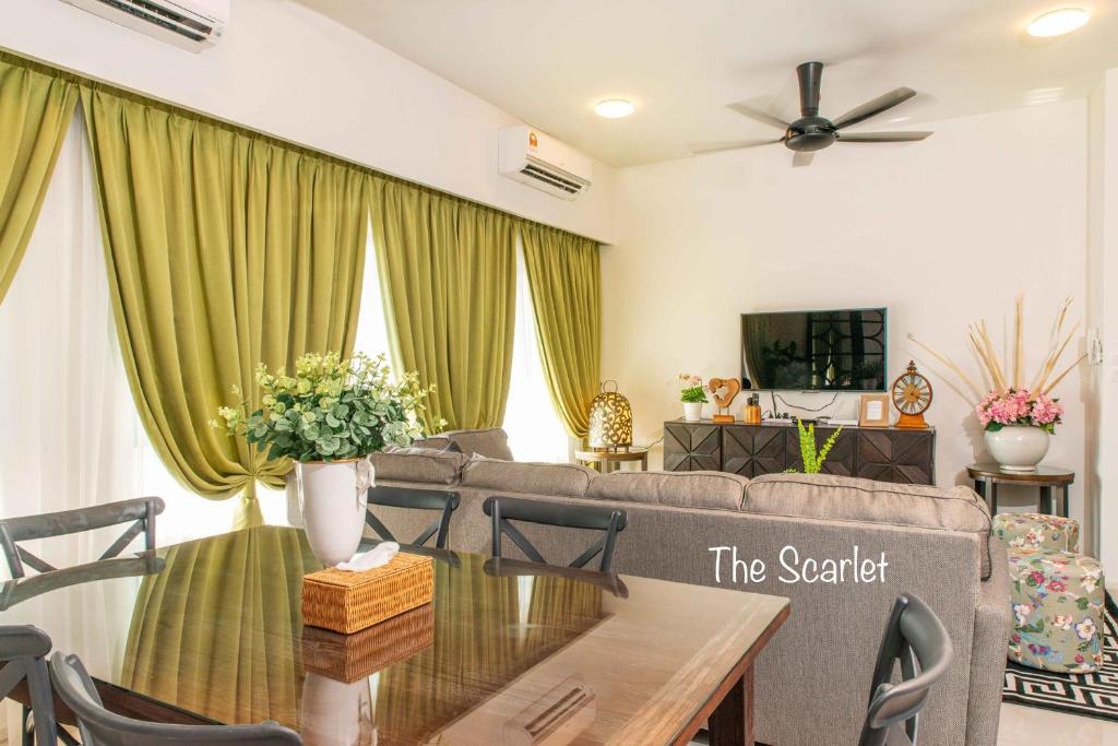 a living room with a couch and a table at The Scarlet @ Sunway Gandaria in Kampong Sungai Ramal Dalam