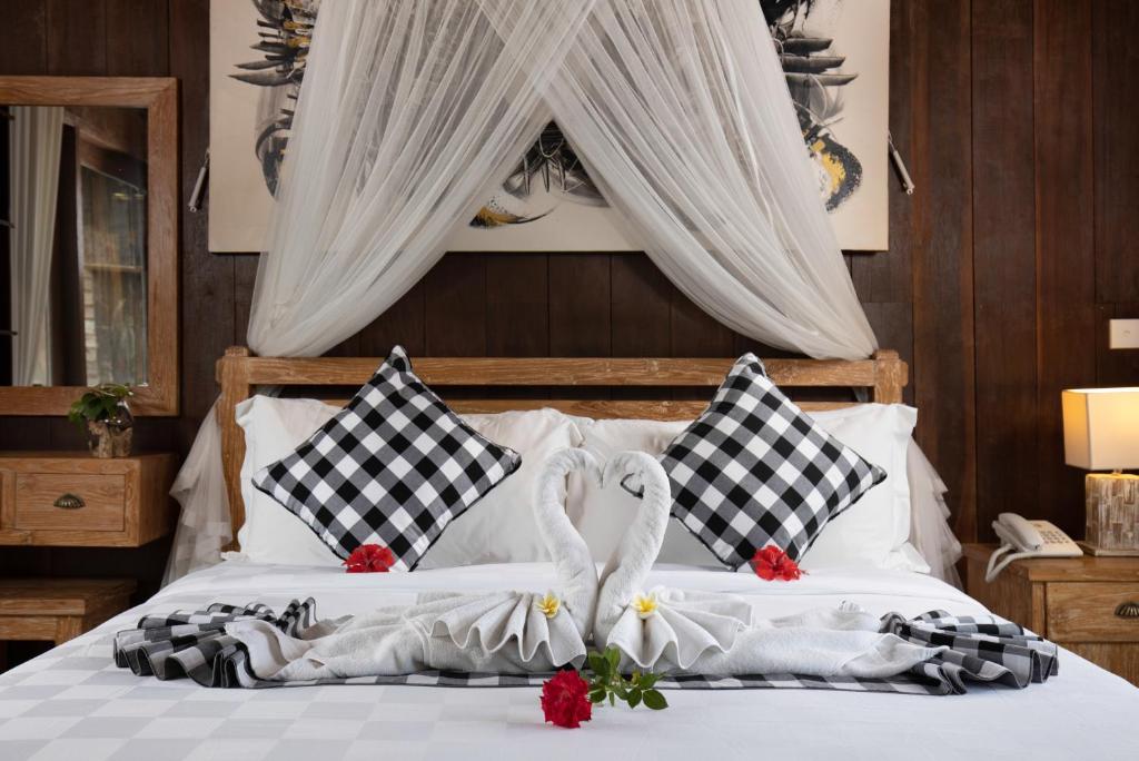 Postel nebo postele na pokoji v ubytování Abian Taksu Suite & Villas