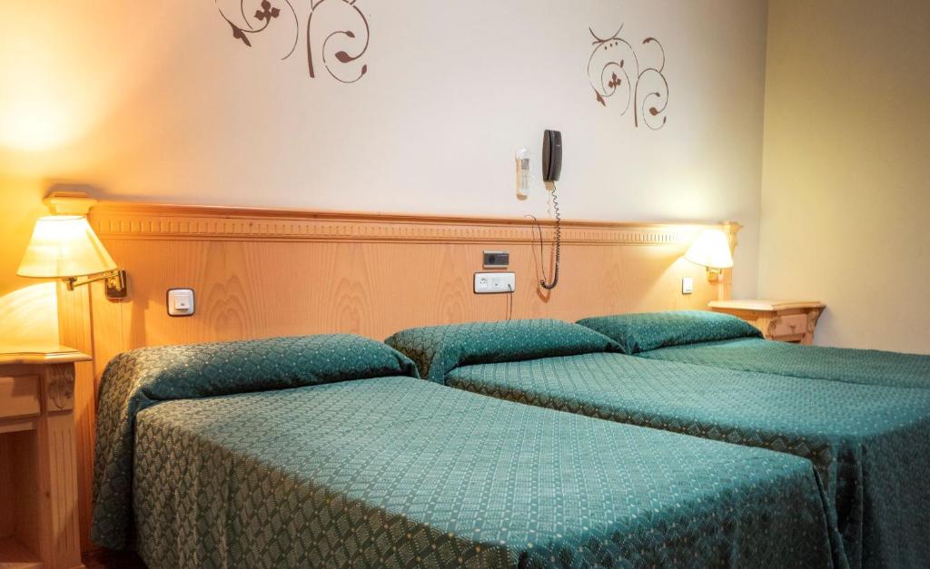 Postelja oz. postelje v sobi nastanitve Hotel El Cruce Chauchina