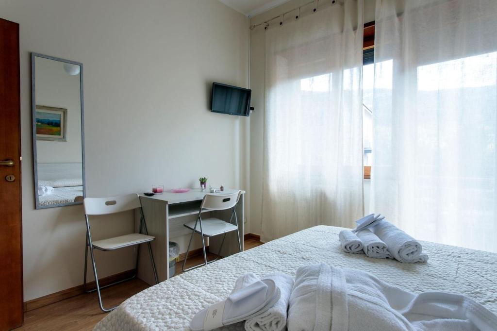 Łóżko lub łóżka w pokoju w obiekcie Porta della Musa